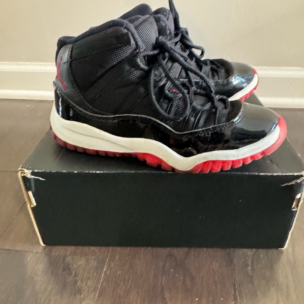 Jordan 11 Retro Black and Red Sneakers